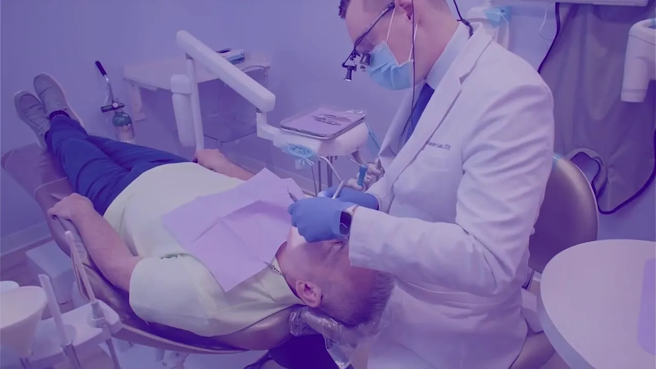 Dr. Godko with a patient in the treatment chair